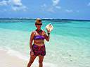 Nancy with a conch shell at Nancy and Walker's secret beach on Anegada