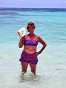 Nancy with a conch shell at Nancy and Walker's secret beach on Anegada