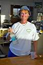 Nancy at work, wearing her Cow Wreck Beach Staff shirt.