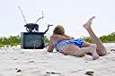 Television, Anegada style.
Nancy found this television on the beach on Anegada's north shore. We dressed it up a bit, making the "rabbit ear" antenna from an oil bottle, some sand and sticks. A nice little coral nick-nack on top, and we are ready to watch television. It turns out that our reflection is the only thing that we can receive on it.