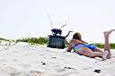 Television, Anegada style.
Nancy found this television on the beach on Anegada's north shore. We dressed it up a bit, making the "rabbit ear" antenna from an oil bottle, some sand and sticks. A nice little coral nick-nack on top, and we are ready to watch television. It turns out that our reflection is the only thing that we can receive on it.