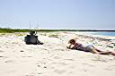 Television, Anegada style.
Nancy found this television on the beach on Anegada's north shore. We dressed it up a bit, making the "rabbit ear" antenna from an oil bottle, some sand and sticks. A nice little coral nick-nack on top, and we are ready to watch television. It turns out that our reflection is the only thing that we can receive on it.