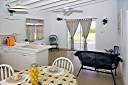 Dining area, kitchen, and living area of the cottage.