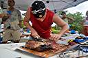 J.F. slicing ribeye at the groundbreaking ceremony for Wali Nikiti, Cele and Davide's new home on Scrub Island.