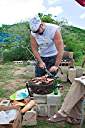 Slicing the goodies on top of a real thick cut slab of tree. This is how real men do it.