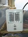 The simple heater. $17.00 at Lowe's. Although rated the same as the original Black and Decker heater, this unit seems to put out more heat, and cost less than half as much. It is controlled entirely by the greenhouse heater control circuit.