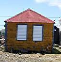 Typical Anegada Settlement shingled structure. This building was once the Anegada church.