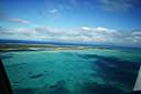 Leaving Anegada -- looking over east end of Anegada. Horseshoe Reef extends to the right.