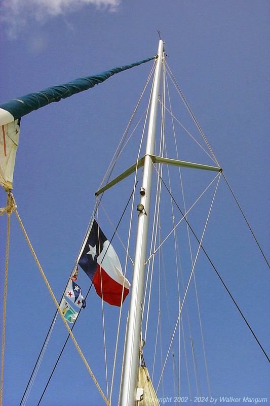 Our flags. From top to bottom, we have the Texas state flag, the Houston Yacht Club burgee, our Mangum personal flag, and the TravelTalk Online flag.