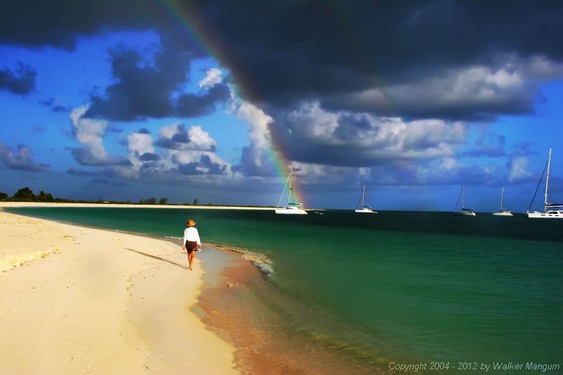 Cele and a rainbow over Pomato Point. Sea Breeze at the end of the rainbow, Sea Leopard on the right. This photo made the cover of BVI Welcome Magazine!